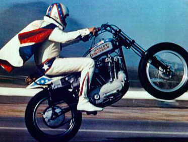 Evel Knievel jumps 16 automobiles in Gardena, California